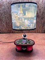 Full view of lamp showing poker dealer base and Las Vegas skyline shade
