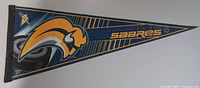 Buffalo Sabres slug logo felt pennant, navy and gold