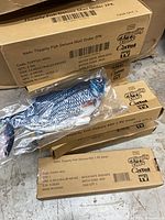 Outer shipping carton with two inner cartons and one bagged Flippity Fish toy