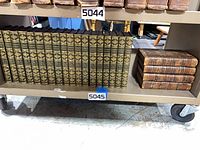 Shelf view showing 17 green leather James volumes and 4 brown leather Gibbon volumes