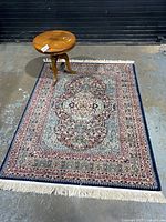 Full view of rug with side table placed on top