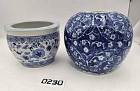 Both porcelain planters side by side showing overall size and designs