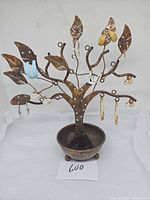 Full view of copper jewelry tree with attached earrings