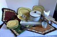 Full lot overview with runner, enamelware, Sebring plates, chicken ceramics