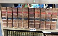 Front view of all ten leather-bound Encyclopaedia Britannica volumes on shelf