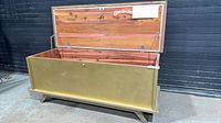 Closed Lane cedar chest showing gold exterior and splayed legs