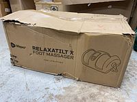 Damaged shipping box showing LifePro RelaxaTilt X Foot Massager graphics
