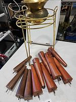 Plant stand, brass planter and wooden legs overview