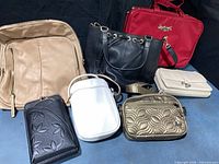 Group shot of all seven handbags