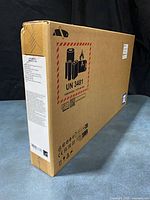 Sealed retail box, UN3481 battery label visible