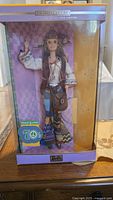 Front view of boxed Peace & Love 70's Barbie doll