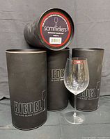 Four Riedel tubes with one glass displayed