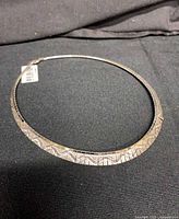 Full view of sterling silver Cleopatra collar necklace laid flat