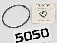 Overall lot showing bangle, necklace card and lot number