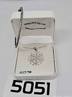 Necklace displayed in original box with bracelet draped alongside, showing overall view