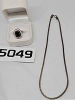 Necklace and ring together for scale and overview