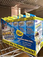 Front and side view of multiple HurriClean boxes on shelf