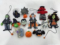 Group shot of all thirteen Halloween pins and toys