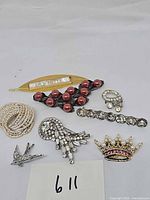 All seven jewelry pieces laid out for overview