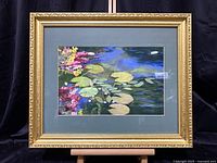 Front view of framed lily pad painting showing full artwork and frame