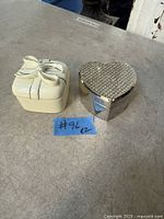 Two trinket boxes side by side, closed