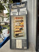 Front of boxed Spacemaker canning shelf showing product image and branding