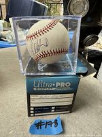 Signed baseball inside Ultra PRO cube on original box