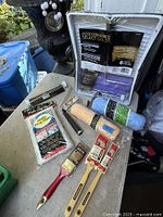 Group shot showing all packaged painting items on table