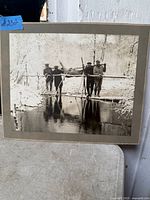 Front view of mounted antique hunting photograph