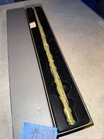 Full view of wand inside open presentation box