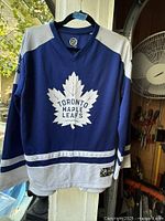 Front view showing Toronto Maple Leafs logo and overall jersey condition