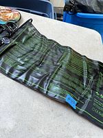 Full view of black seedling heat mat showing printed care instructions