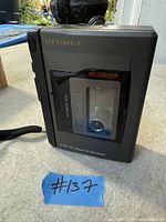 Front view showing Optimus CTP-112 cassette recorder, clear window, Recorder label