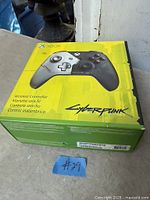 Retail Xbox Cyberpunk 2077 controller box showing front and back graphics