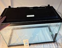 Aquarium with lid shown from angle, cord visible