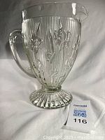 Full view of clear Iris and Herringbone pitcher left side.