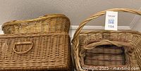 Two large rectangular baskets and oval basket stacked, showing overall form and weave