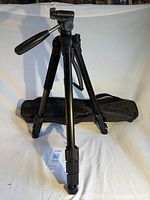 Full view of tripod standing with carry case beneath
