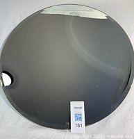 Full view of round frameless mirror