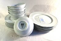 Stacked bowls, plates and underside showing Ikea Upplaga mark