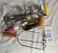 All four vintage kitchen utensils