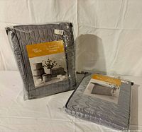 Front view of sealed dinnerware storage package showing brand and product image