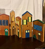 Overall view of six hinged wooden house panels forming village scene