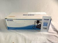 Closed box showing Chtoocy wireless driveway alarm branding