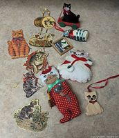 Group shot of all twelve cat-themed ornaments on countertop