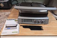 Griddler Elite unit with manual and scraper shown