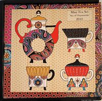 Box lid showing Mini Tea Set 2010 graphics