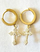 Front view of both gold-plated sterling silver hoop earrings with crystal cross dangles