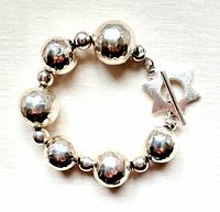 Bracelet arranged in circle showing beads and clasp