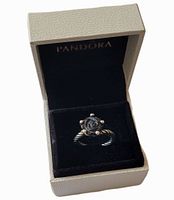 Ring in Pandora box, lid open showing interior and placement